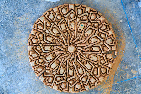 Making of Moroccan mosaic in a factory placing the tiles upside down on the ground