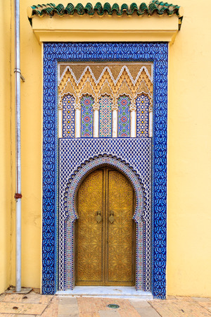 Entrance door with mosiac and brass door at the Royal palace in Fes Moroccoのeditorial素材