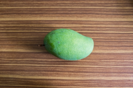 green mango on wood backgroundの写真素材