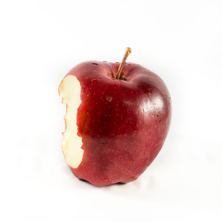 bitten red apple on a white backgroundの写真素材