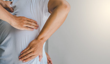 Physiotherapist consulting with patient about backbone pain problems.Physical therapy concept
