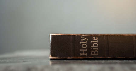 The Holy Bible is on a cement table.Religion conceptの写真素材