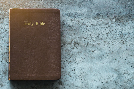 The Holy Bible is on a cement table.Religion conceptの写真素材