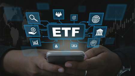 ETF,Exchange traded fund.Businessmen using a tablet with icons of ETF.Business finance concept.Stock...