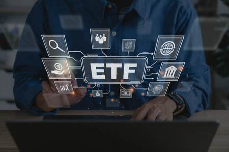 ETF,Exchange traded fund.Businessmen using a labtop with icons of ETF and trading.Business finance...