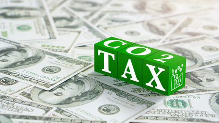Concept of green Co2 Tax.Carbon tax, environmental and social responsibility business concept. Taxation for nature pollution.Wooden cubes with CO2 TAX word and US dollars.の写真素材