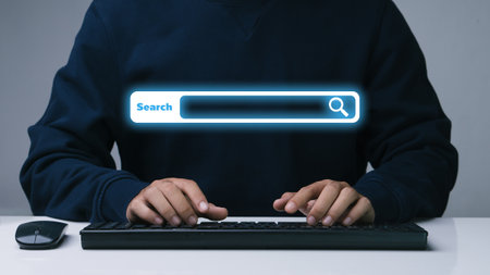 Data Search Technology Search Engine Optimization.businessman working with computer on desk in office. Networking Concept.Searching Browsing Internet Data Information with blank search bar.の写真素材