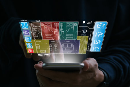 Smart home concept.Hand of man using smart home control app on mobile phone.Remote home control.Smart home technology.の写真素材