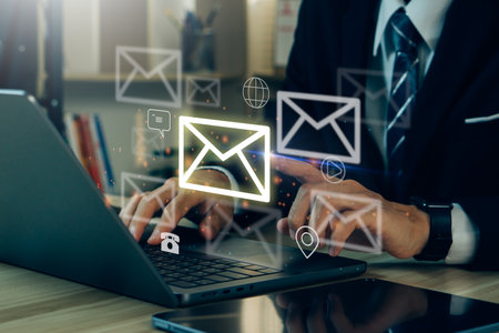 Email concept.Businessman using laptop for email with notification alert, Online communication concept.email icons.の写真素材