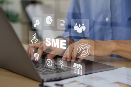 SME,Small and Medium-sized Enterprises concept.Business man taking note of customers address on laptop.Marketing,e-commerce,enterprise,strategy.の写真素材