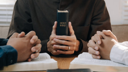 Christian man hands holding the holy bible to pray and worship God in the sunday morning.spirituality, religion,believe.Christian life.Studying the word of God in church.の写真素材