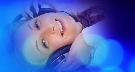 Young pretty woman listening musicの写真素材