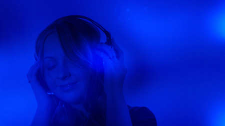 Young woman listening musicの写真素材