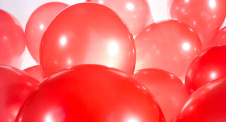 Vivid red balloons birthday backgroundの写真素材