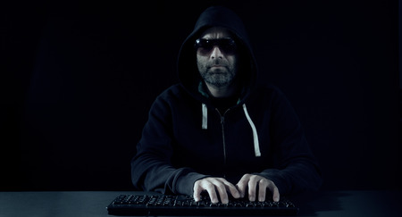 Computer hacker attack, black backgroundの写真素材