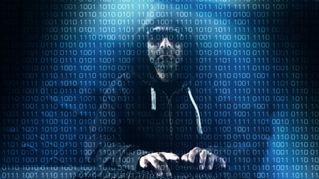 Computer programmer typing on keyboard, hacker hacking at night
