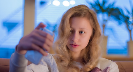 Selfie portrait, girl with smart phoneの写真素材