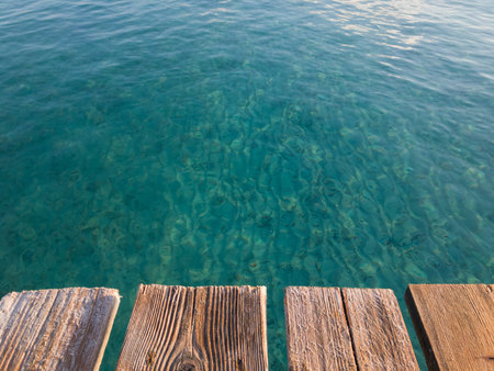 Rustic wooden boards pier, summer vacation background