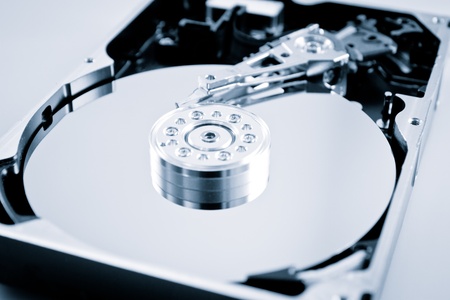 an opened hard disk, color processed, studio shotの写真素材