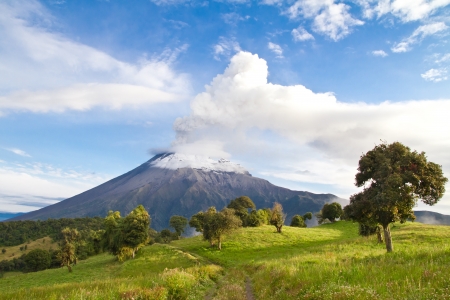 Tungurahua Volcano erupting at sunrise with a clowd of smokeの写真素材