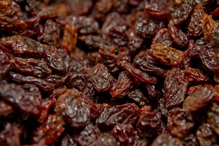 Close up of a group of black raisinsの写真素材