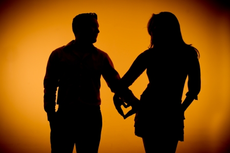 couple silouette photography holding handsの写真素材