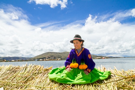 Young girl on a floating Uros island, Titicacaの写真素材