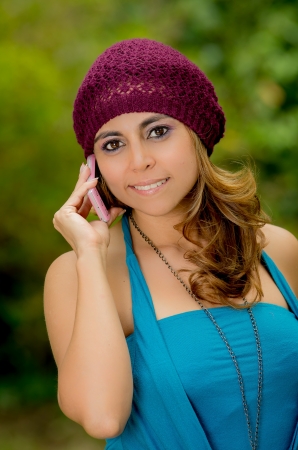 Young smiling woman talking phone calling の写真素材