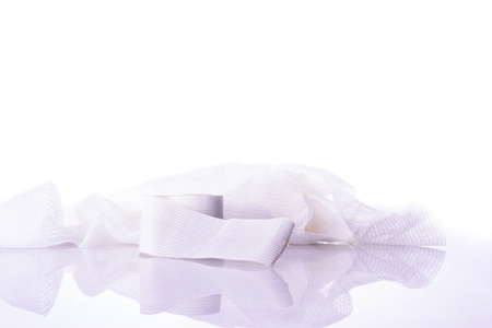 White medical cotton gauze bandage on whiteの写真素材