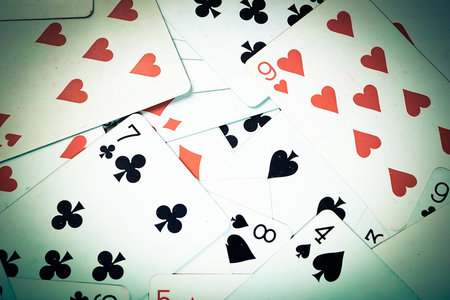 Large collection of used playing cards, closeup