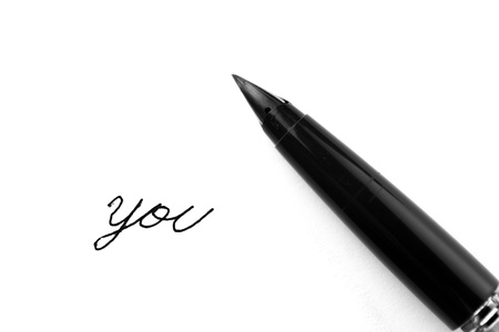 Antique fountain pen writing the word YOU の写真素材