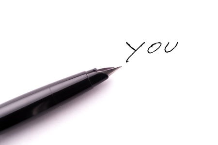 Antique fountain pen writing the word YOU の写真素材
