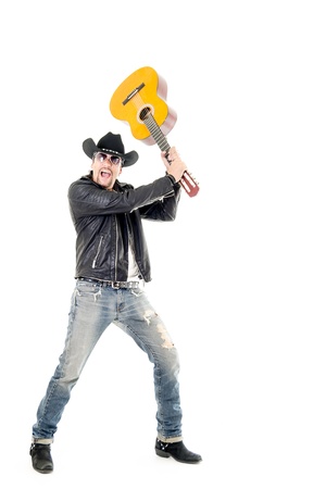 rocker man breaking a guitarの写真素材