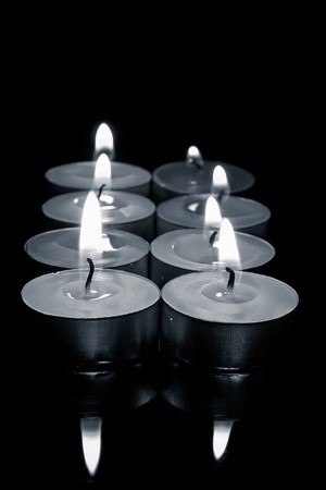 row of candles, in black and white photograph の写真素材