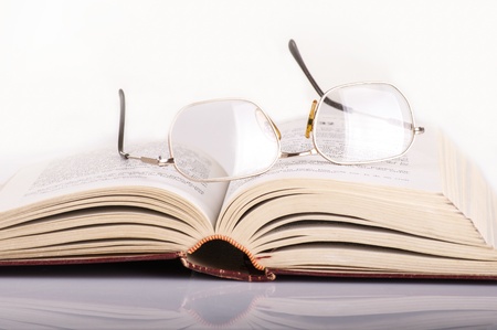 old book with glassesの写真素材