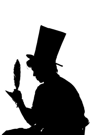 silhouette man sitting on a stool while writing in a notebook with a penの写真素材