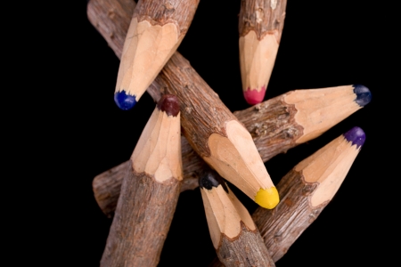 bunch of pencils stylized tree branch  on blackの写真素材