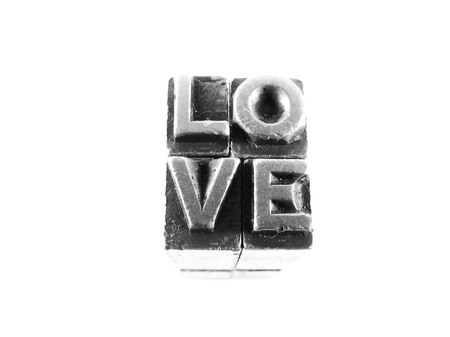 Love sign,  antique metal letter-press type isolatedの写真素材