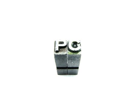 PC sign, antique metal letter type isolatedの写真素材