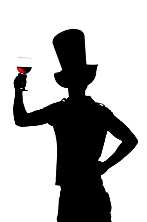 silhouette of a man with a glass of red wineの写真素材