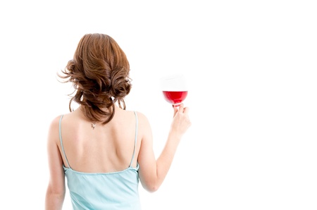 Beautiful brunette girl drinking red wine isolatedの写真素材