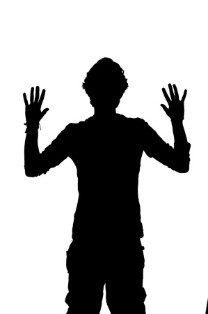 silhouette of a man being robbed with hands upの写真素材