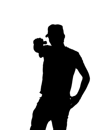 silhouette of a young male pointing gun  の写真素材