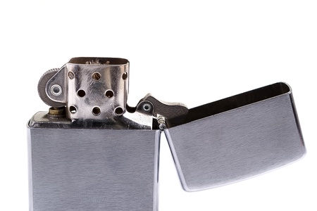 Silver metal zippo lighter isolated on whiteの写真素材