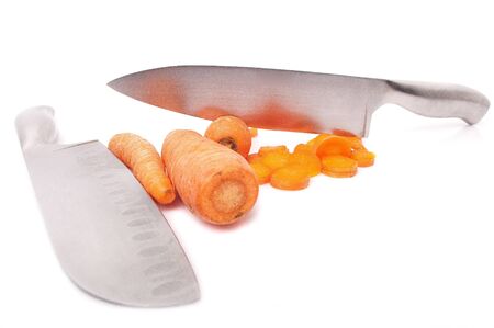 Fresh carrots knifed isolated on a white background. The concept - a dietary food, a diet for weight reduction.の写真素材
