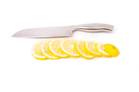 yellow Lemons and slice on a white backgroundの写真素材