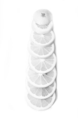 Black and white Lemons and slice on a white backgroundの写真素材