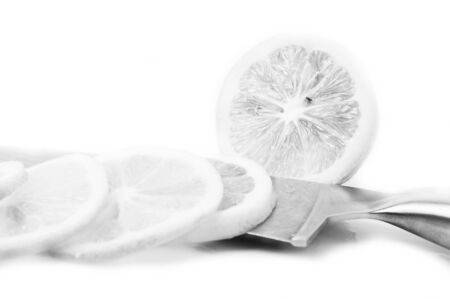 Black and white Lemons and slice on a white backgroundの写真素材