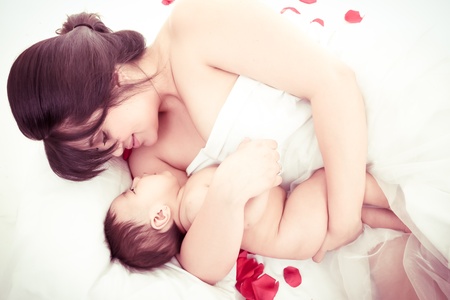 picture of happy mother with baby over whiteの写真素材