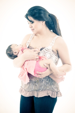 Studio shot of loving mother holding babyの写真素材